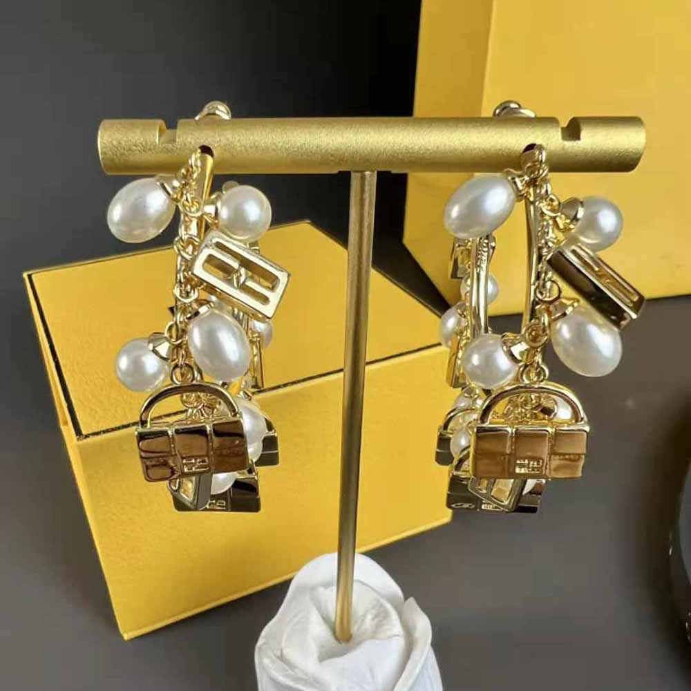 Close-up detail of gold finish on Fendi Women Baguette Earrings Gold-colored