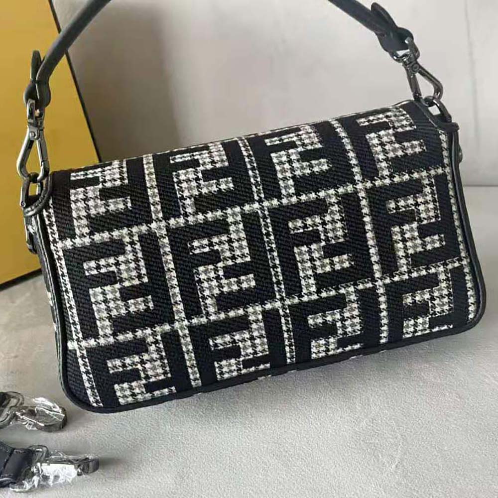 Side angle showing silhouette and strap detail of Fendi Women Baguette Wool Bag