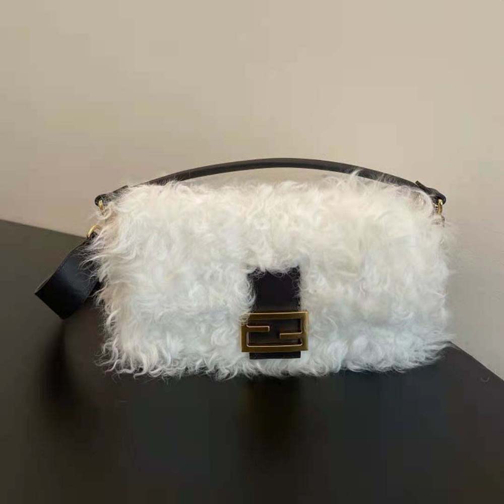 Close-up of gold-tone hardware and Fendi logo on white mohair wool bag
