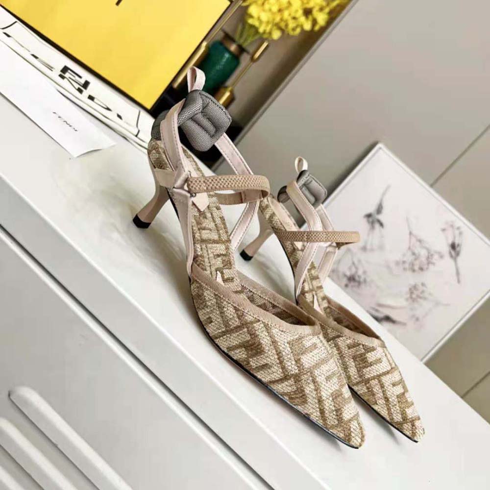 Close-up of beige chenille and gold Fendi hardware on slingback heel
