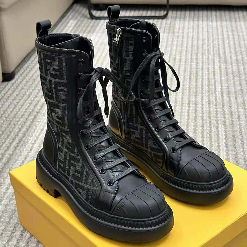 Close-up of silver hardware detail on Fendi Women Domino Black Leather Biker Boots