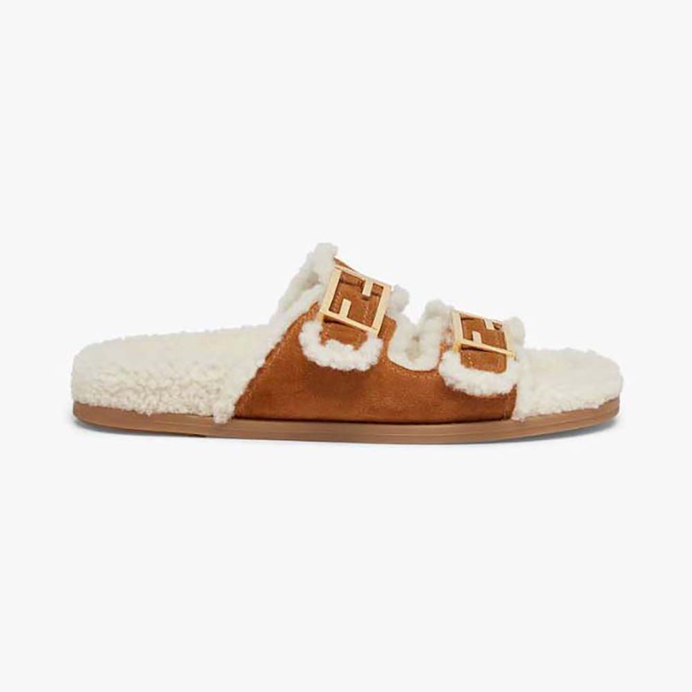 Side angle of Fendi Women Feel White Sheepskin Slides showing brown sheepskin