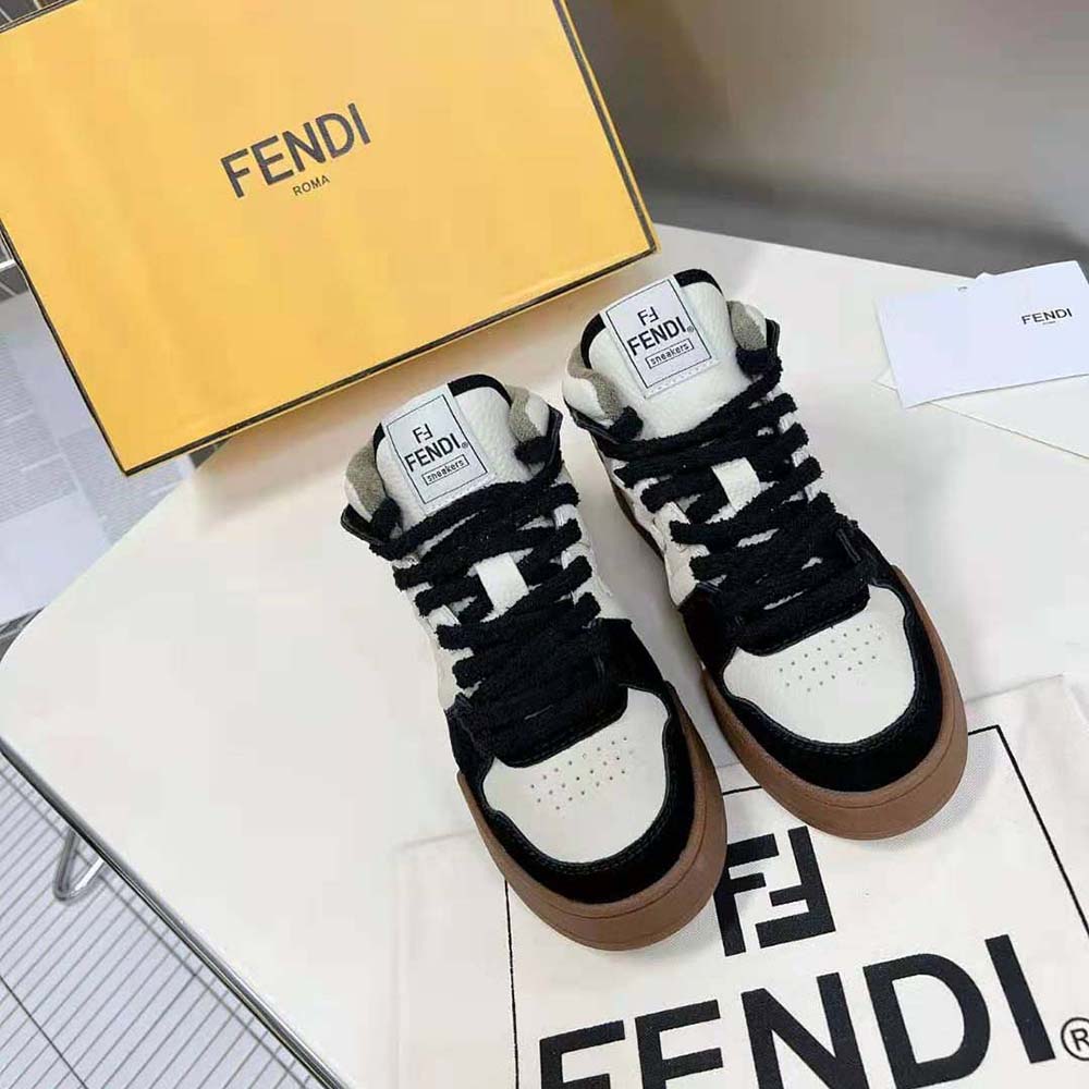 Close-up of embossed Fendi logo on black leather high-top sneaker