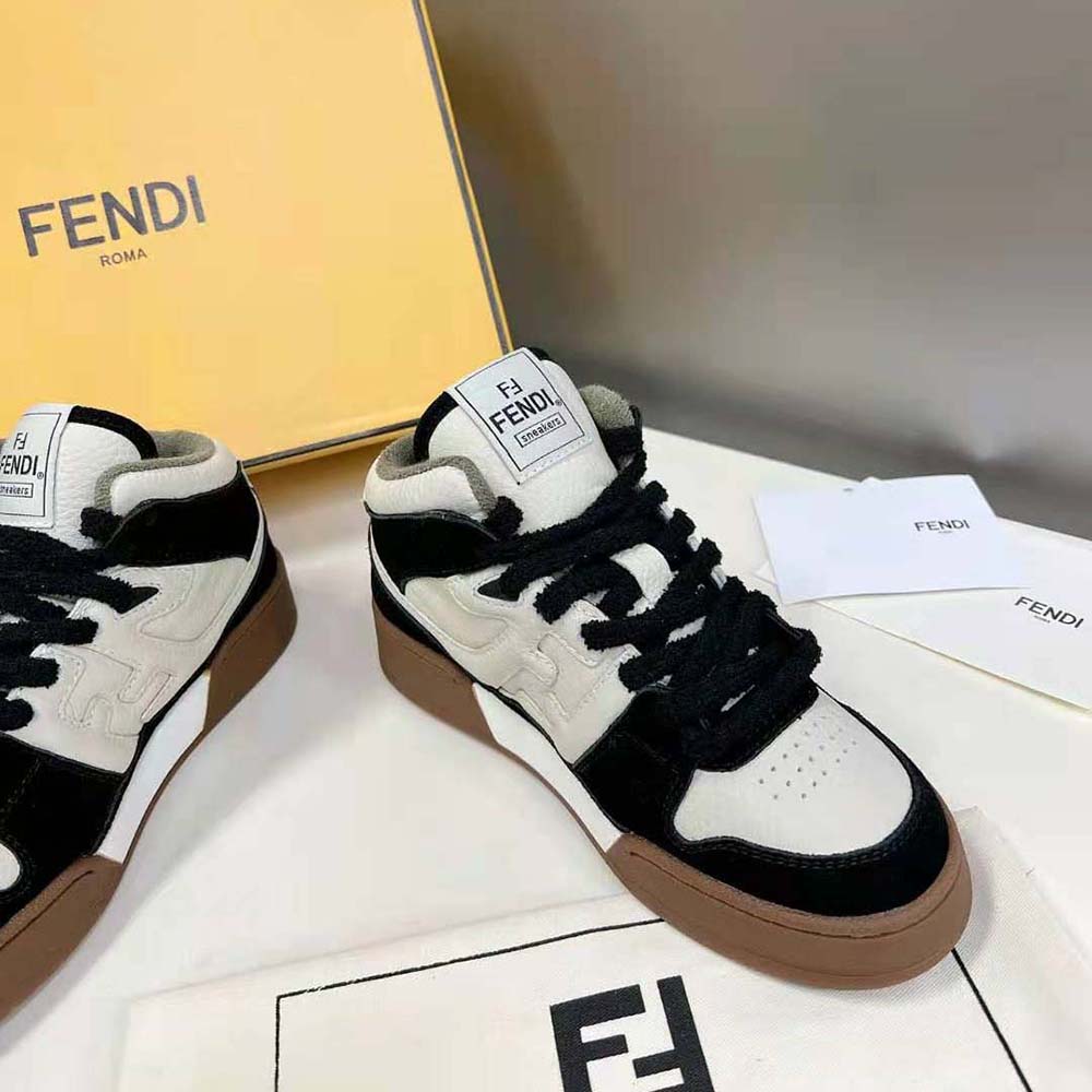 Top-down angle showing lace-up closure on Fendi black leather high-tops