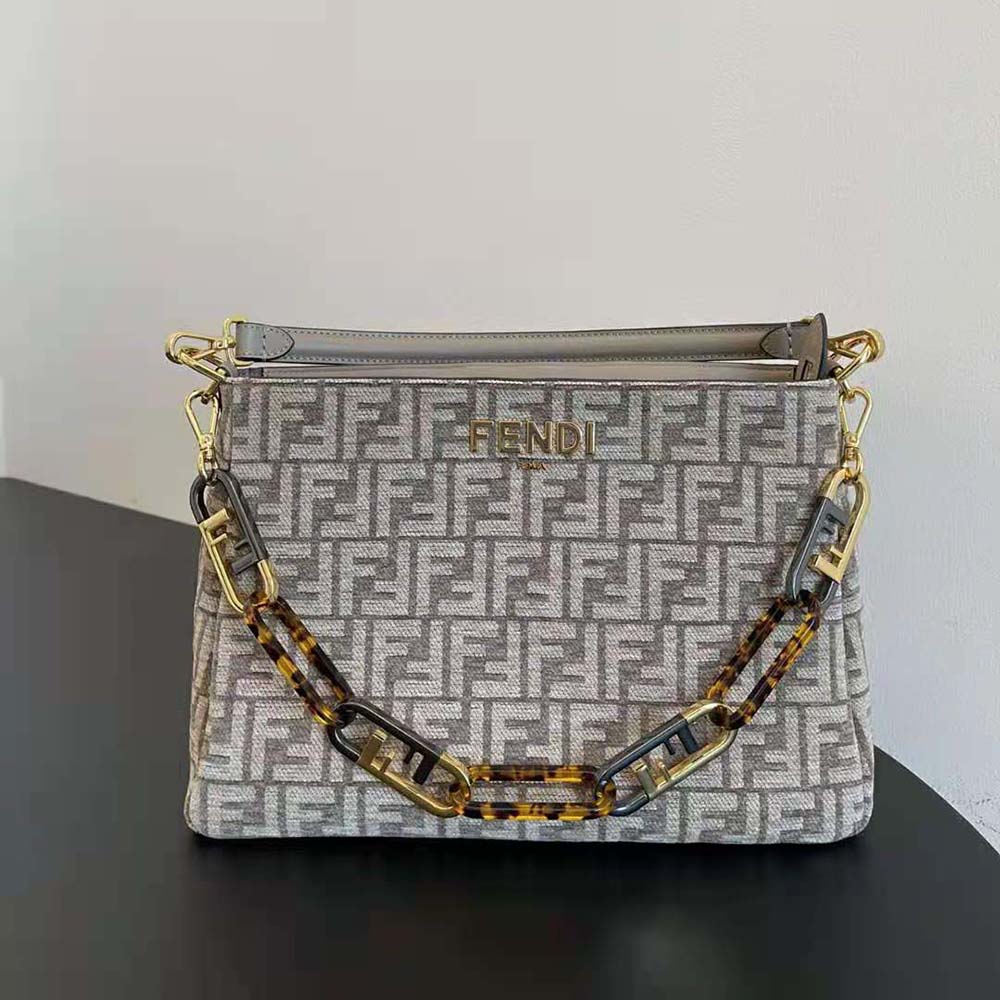 Close-up of O’Lock zipper detail on Fendi tapestry fabric bag