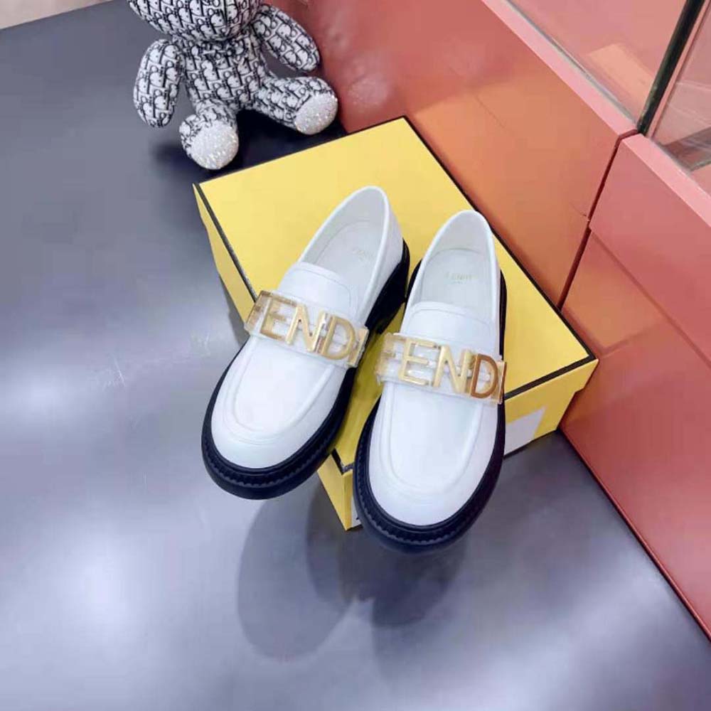Overhead shot of Fendi Women Fendigraphy White Leather Loafers on neutral background