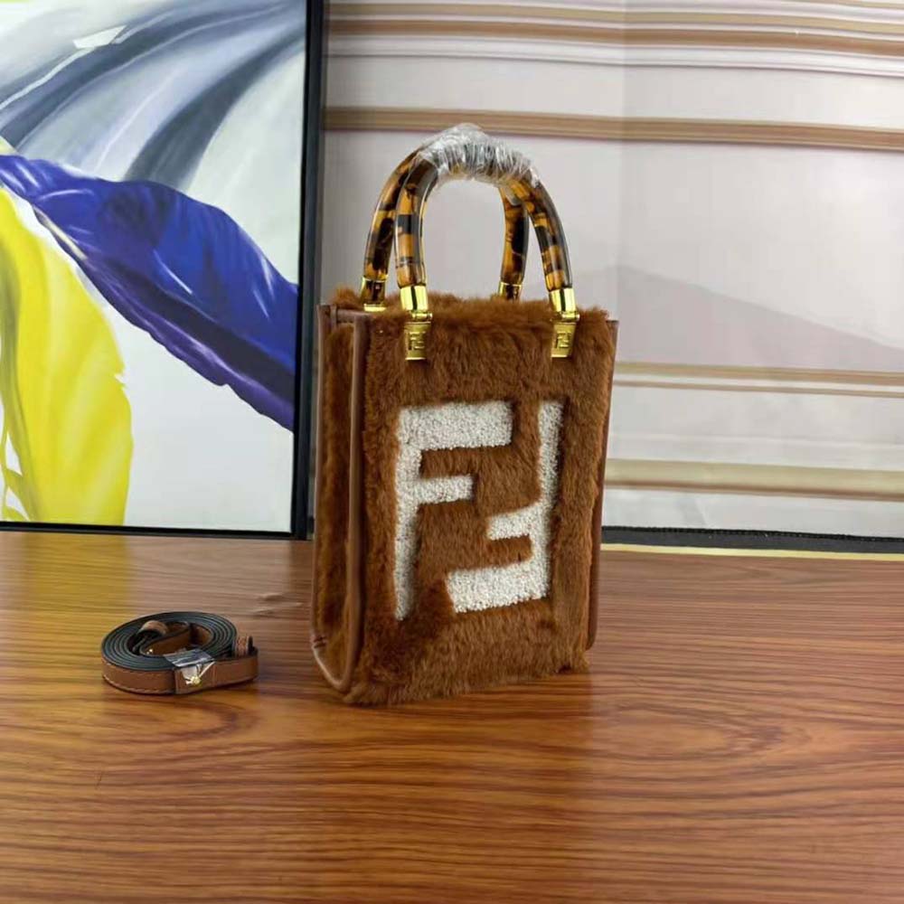 Side angle showing supple sheepskin texture on Fendi Mini Sunshine Shopper