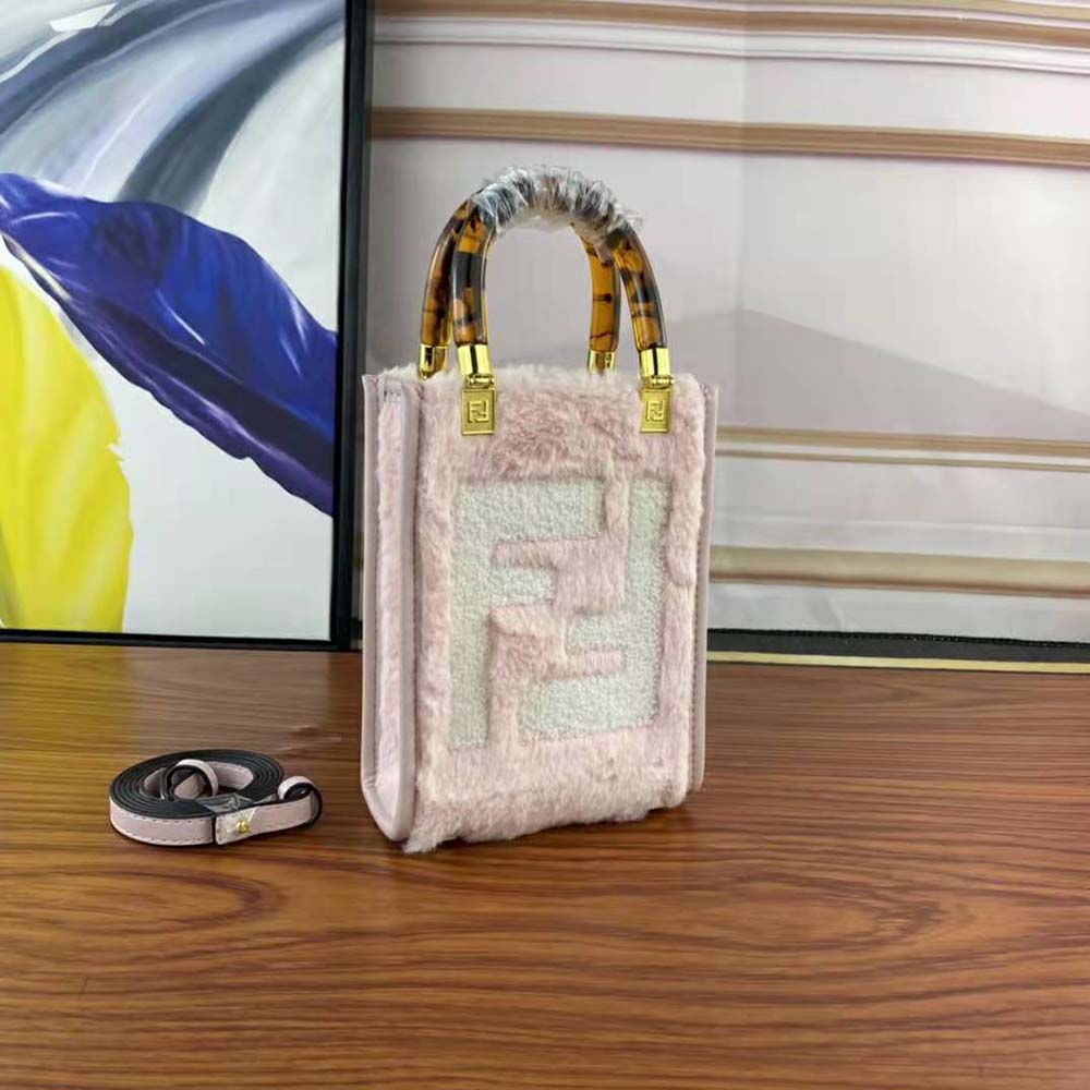 Side angle showing compact silhouette of Fendi Women Mini Sunshine Shopper Pink Mini-Bag