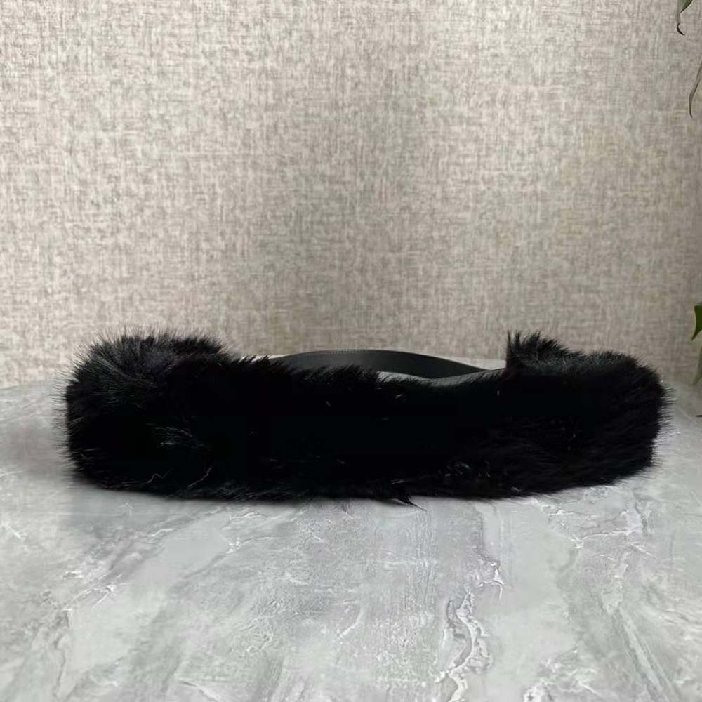 Side angle showing luxurious black fox fur texture and leather pouch