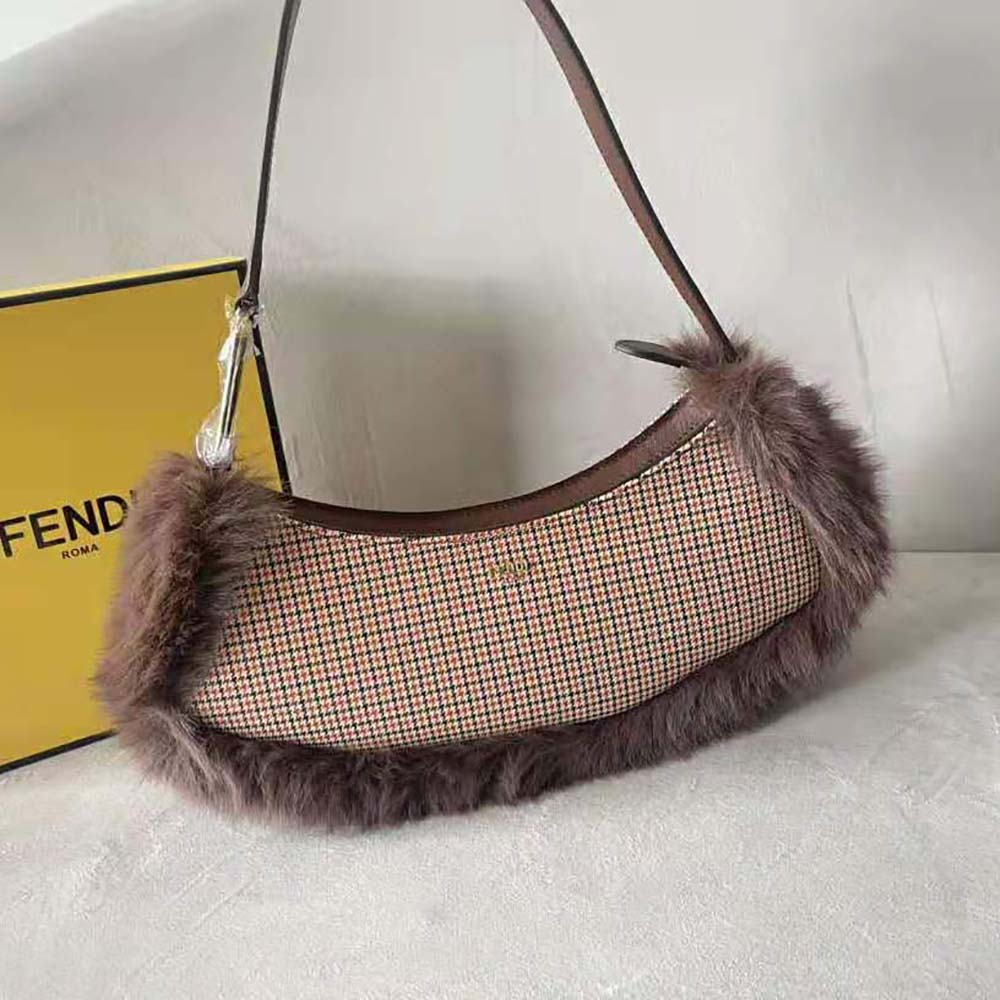 Close-up of gold O’Lock clasp on Fendi Women O’Lock Swing bag