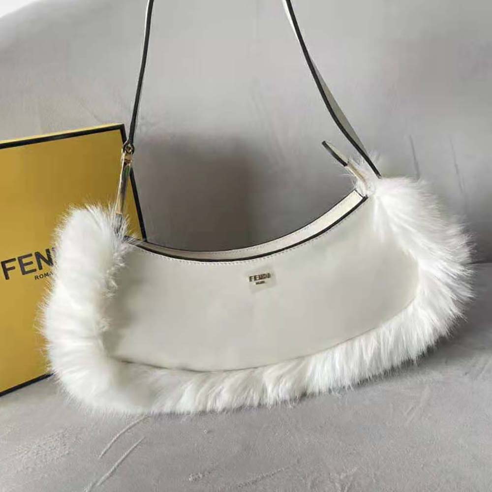 Close-up of O’Lock clasp and fox fur detail on Fendi pouch