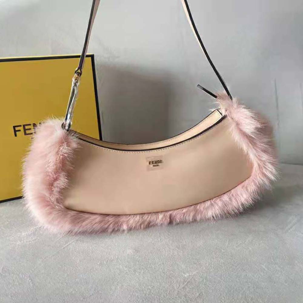 Close-up of gold-tone O’Lock clasp on Fendi Women O’Lock Swing Pale Pink Leather and Fox Fur Pouch