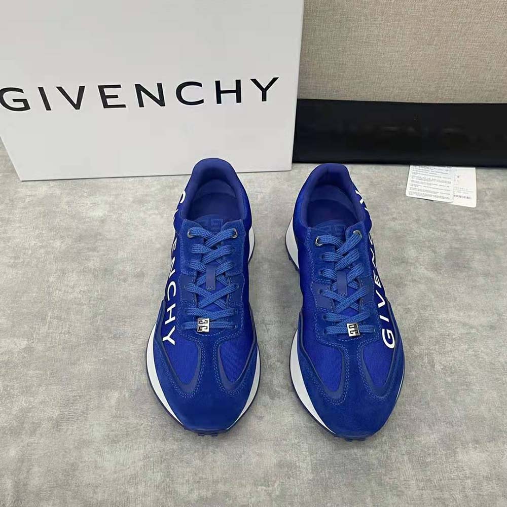 Close-up of Givenchy logo detail on blue GIV Runner Sneakers