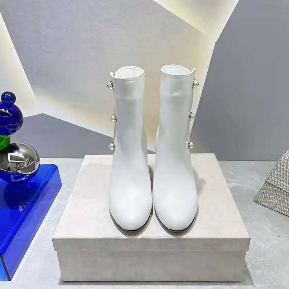 Close-up of pearl embellishments on Jimmy Choo Women Rina 85 Latte Leather Boots