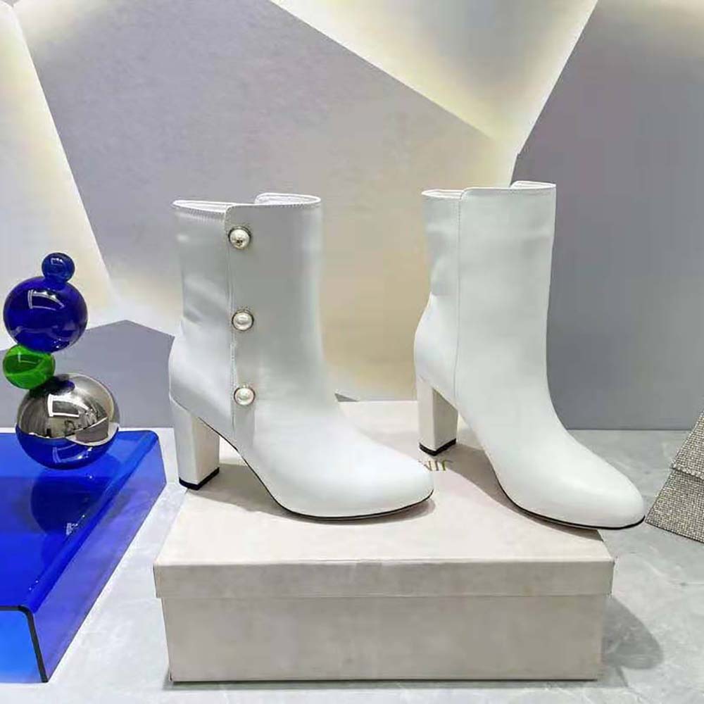 Front angle showing 85mm heel on Jimmy Choo Women Rina Mid-Calf Boots