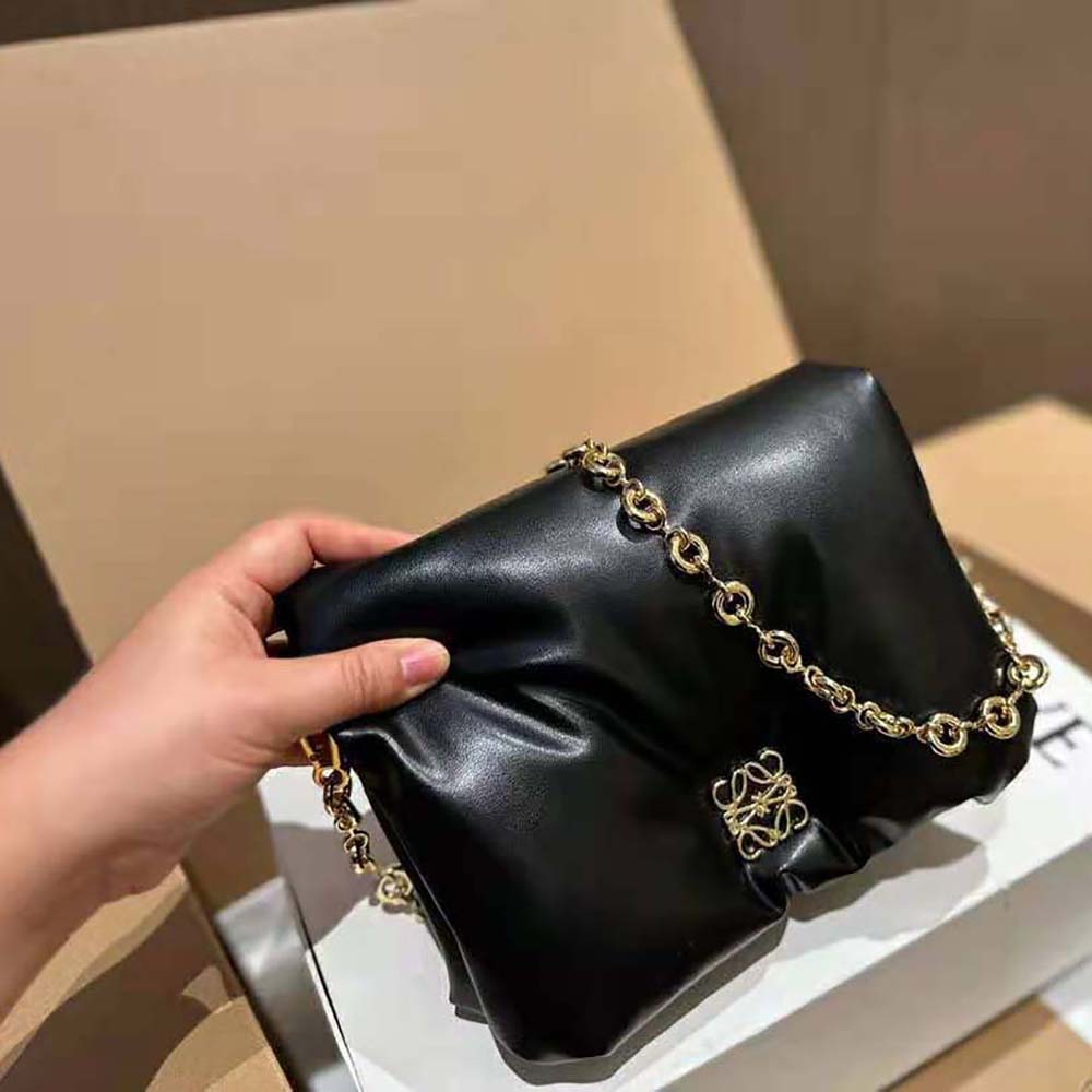 Side profile showing padded silhouette of Loewe Women Puffer Goya Bag Black