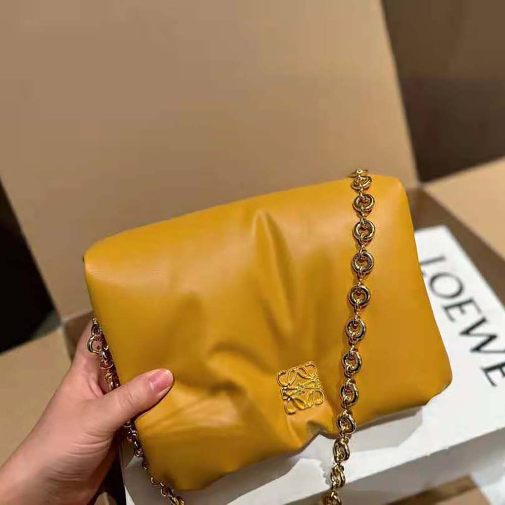 Side angle showing silver hardware on Loewe Women Puffer Goya Bag
