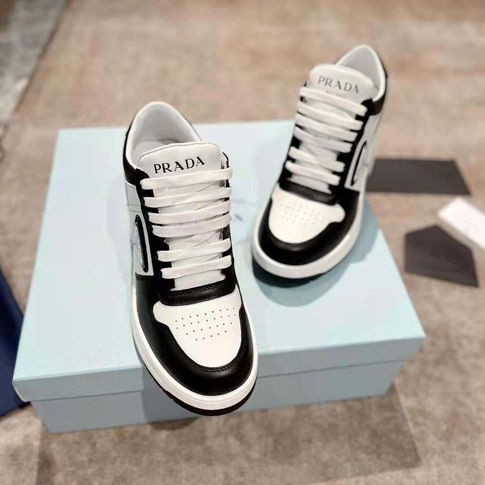 Close-up of black leather and signature hardware on Prada Women Downtown Sneakers