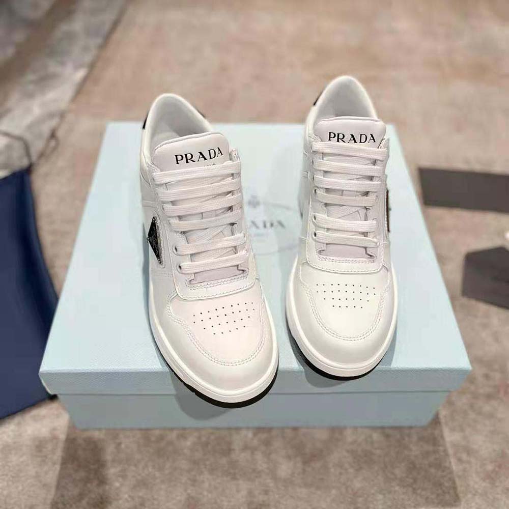 Close-up on lace-up closure and silver Prada logo hardware