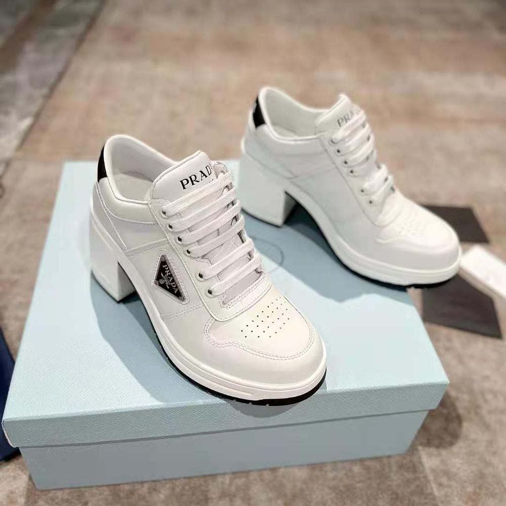 Top-down angle showing white leather texture on Prada High-Heeled Sneakers