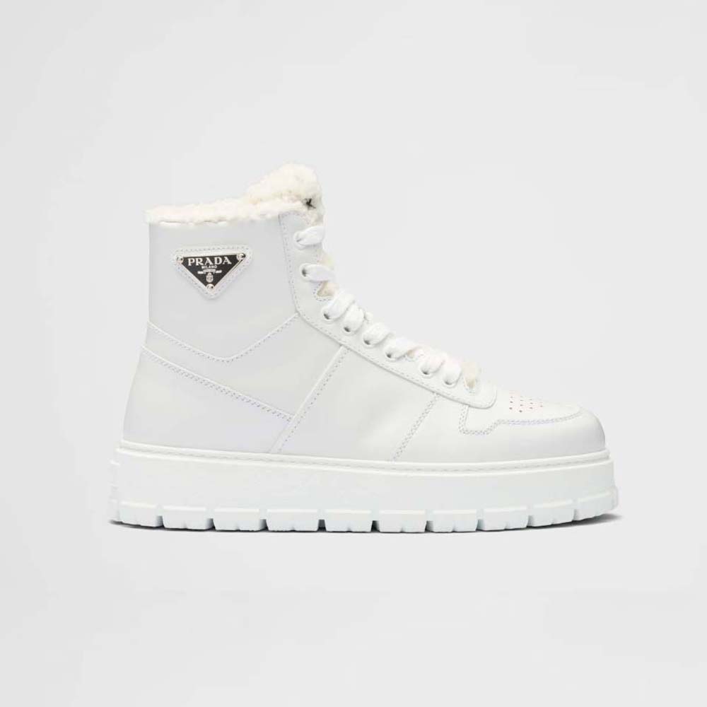 Side view of Prada Women Leather and Shearling High-Top Sneakers-White