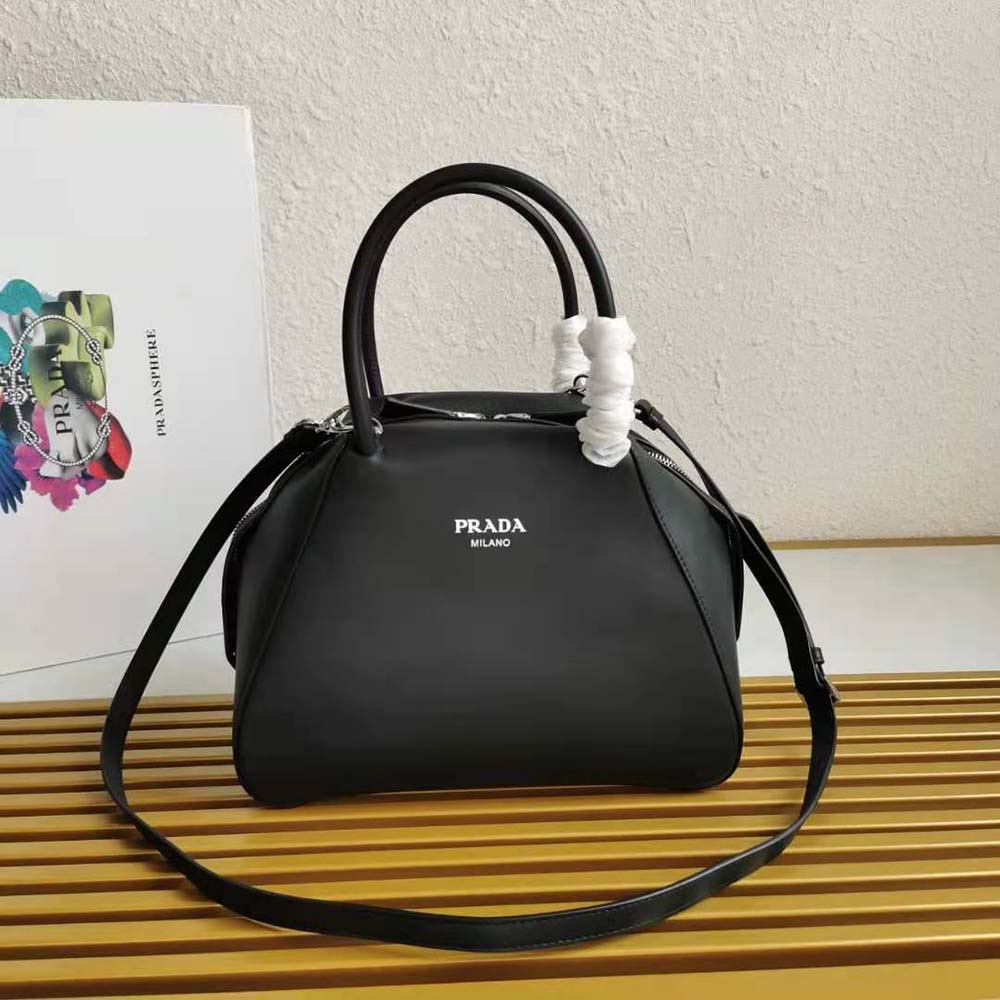 Close-up on silver Prada logo plaque of Prada Women Small Leather Prada Supernova Handbag