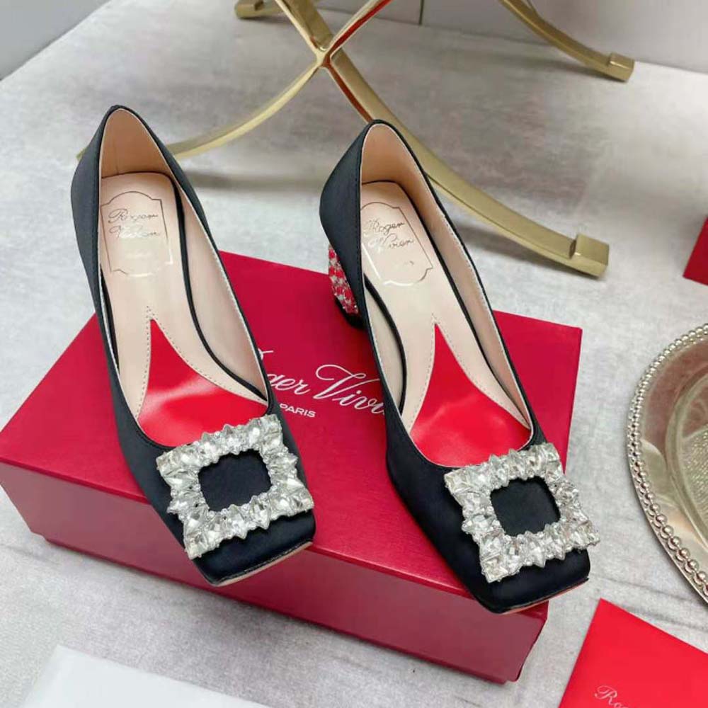 Rear angle highlighting jewel-embellished heel on Roger Vivier satin pumps