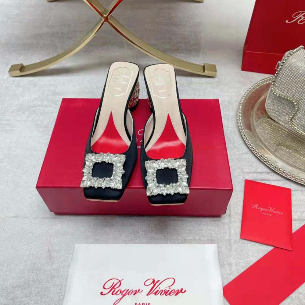 Close-up detail of sparkling rhinestone buckle on Roger Vivier satin mule