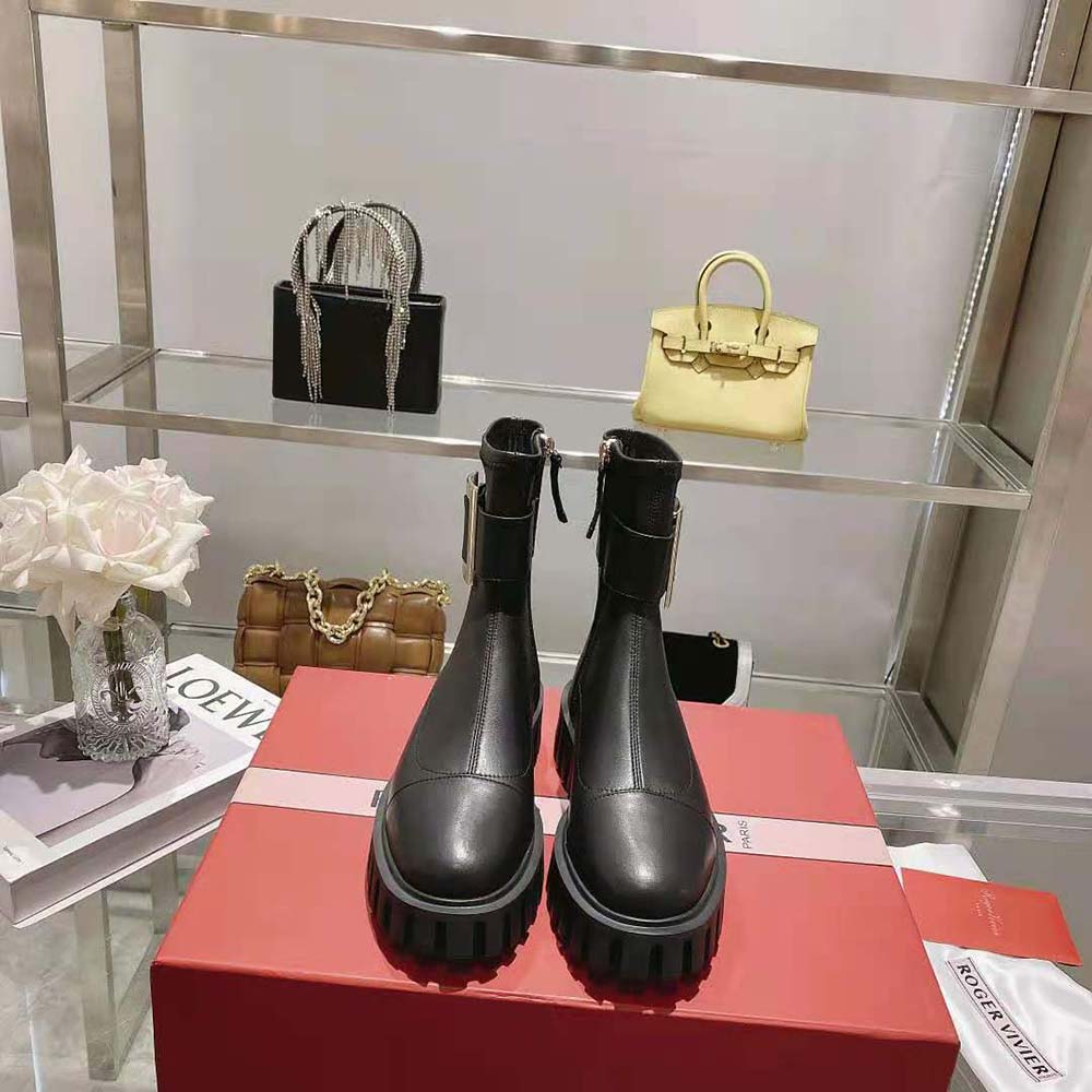Close-up of thick metal buckle on Roger Vivier stretch ankle boots