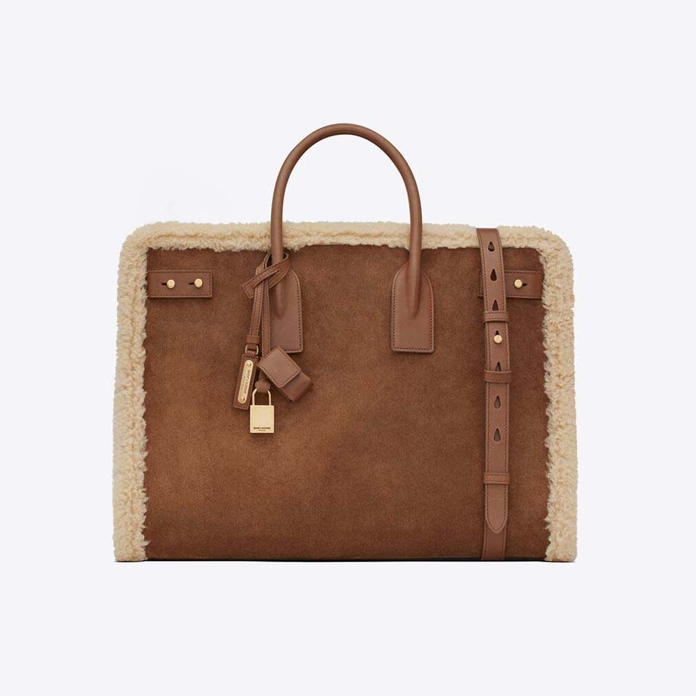 Front angle of Saint Laurent YSL Men Sac De Jour Thin Large in brown shearling