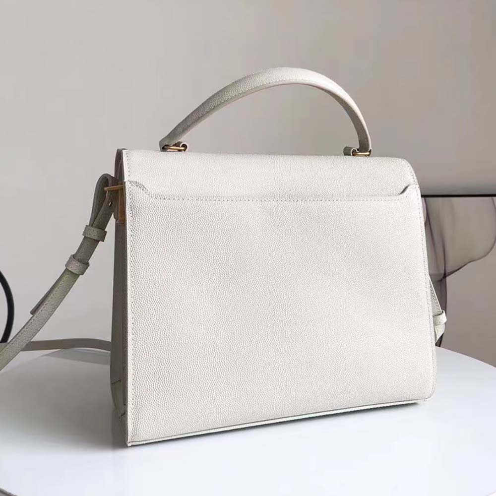 Side profile highlighting structured silhouette and top handle of the Saint Laurent YSL bag