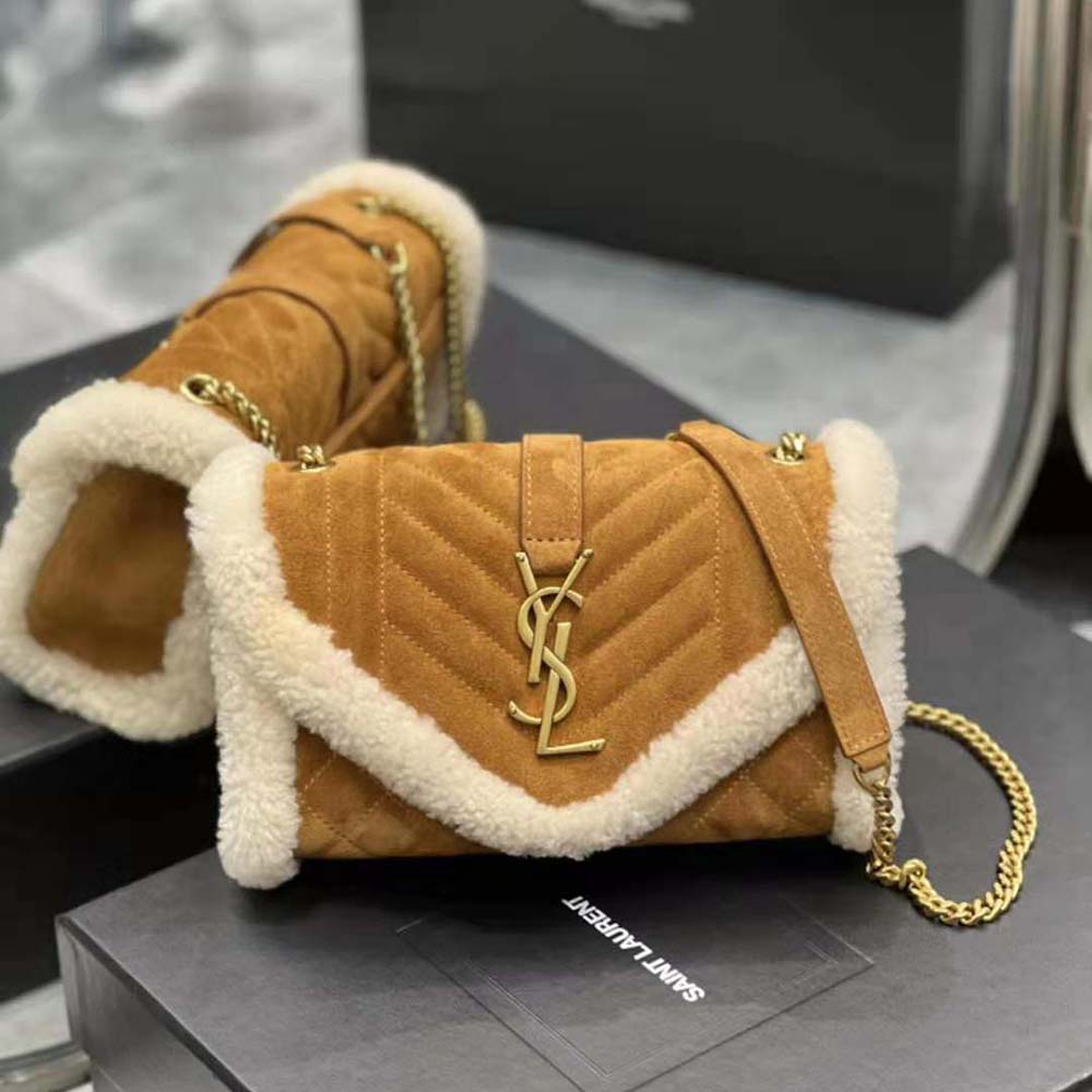 Close-up detail of gold YSL logo on suede and shearling bag flap