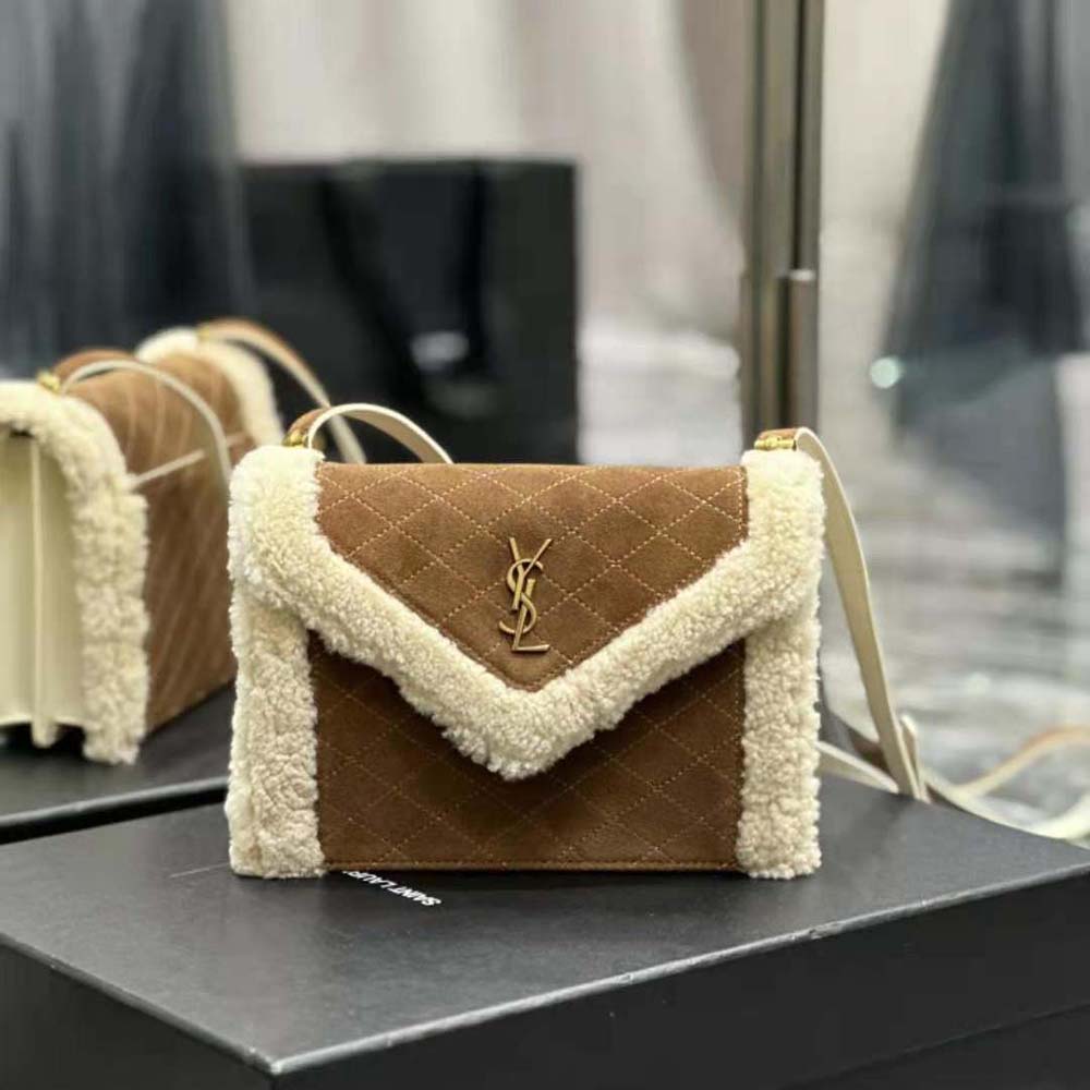 Close-up of shearling trim and gold YSL logo on the Gaby Satchel
