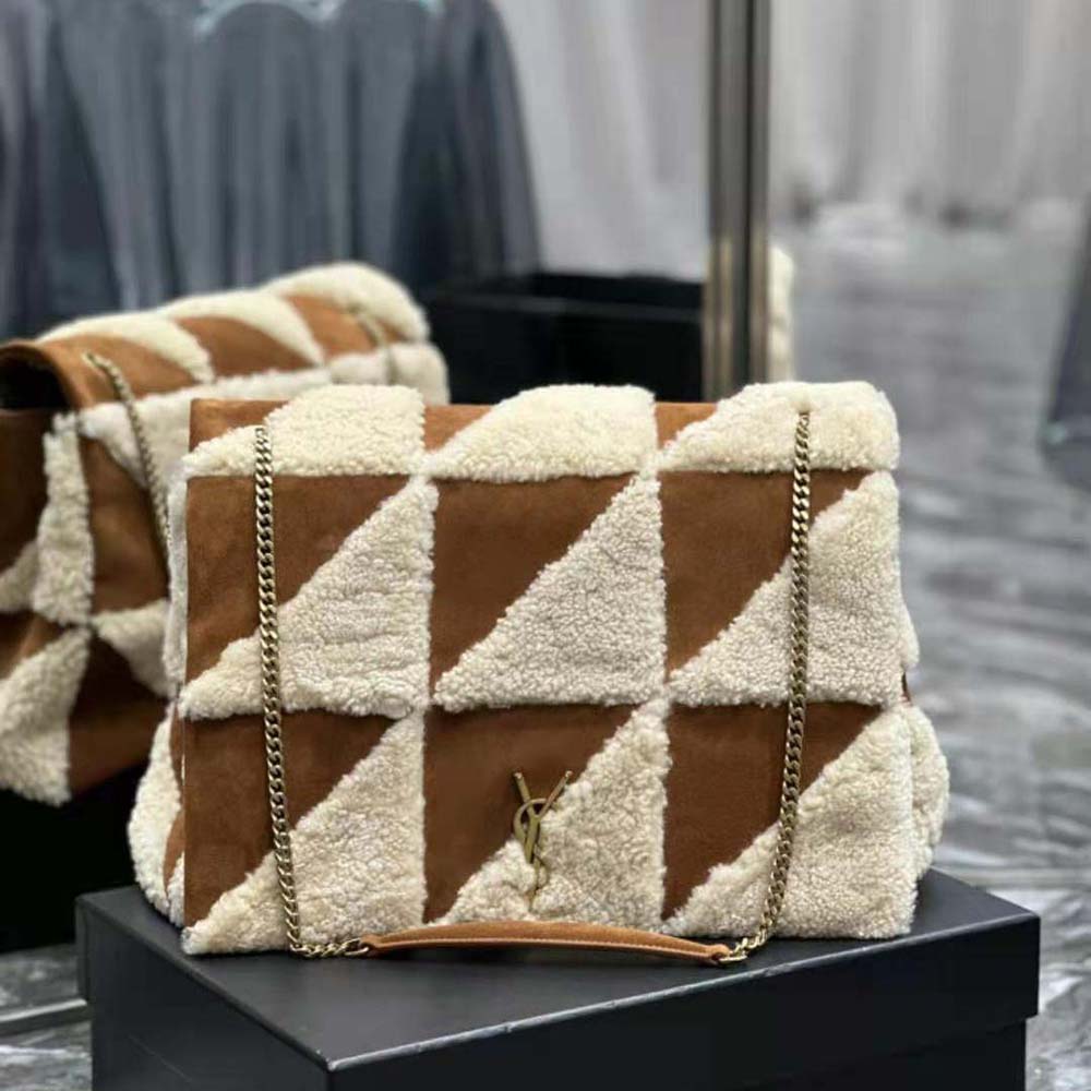 Close-up of gold oversized YSL chain on Jamie Giant Chain Bag brown patchwork