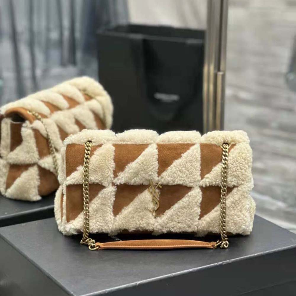 Close-up on gold YSL logo and chain hardware of Jamie medium bag