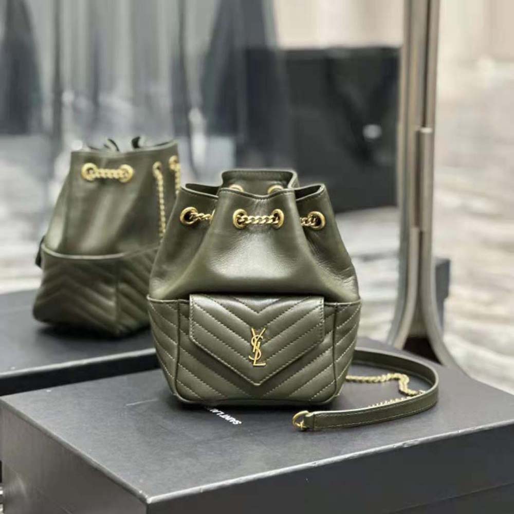 Close-up of gold YSL logo hardware on green lambskin Joe Backpack