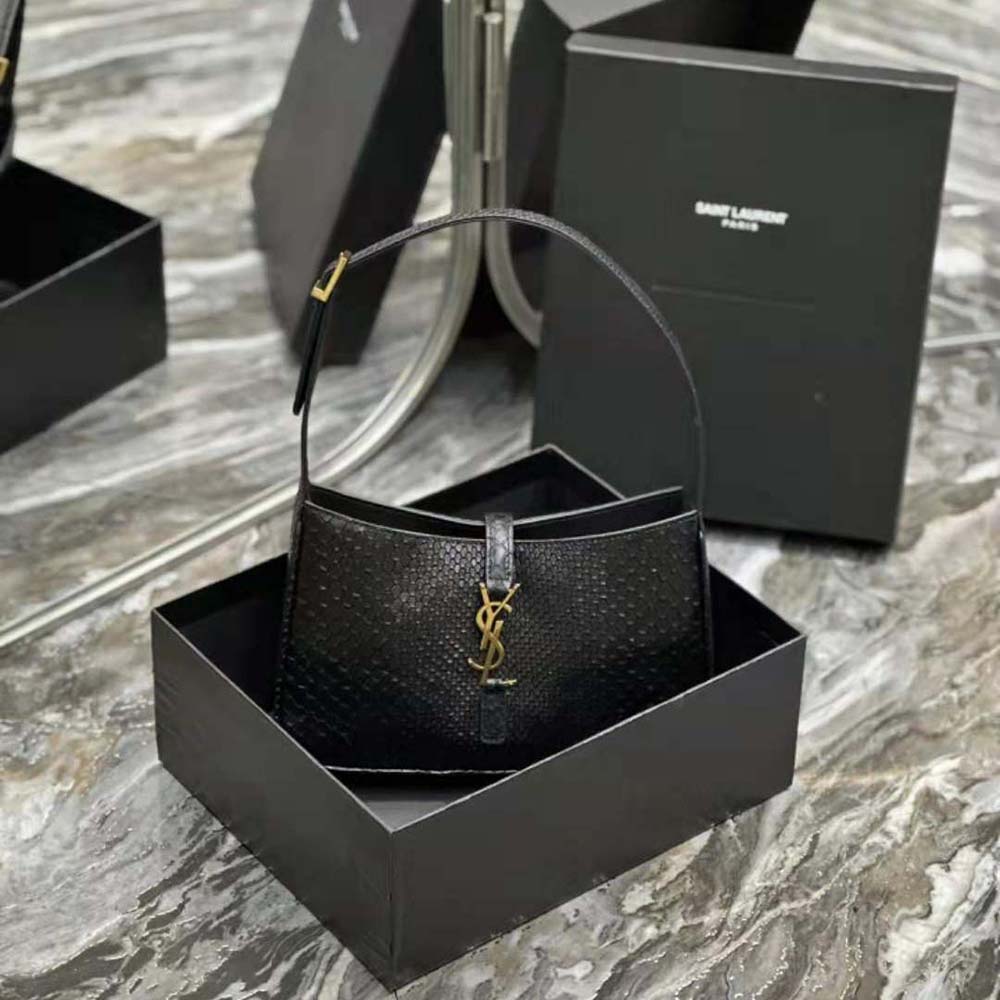 Close-up of gold YSL logo hardware on Le 5 A 7 Hobo Bag