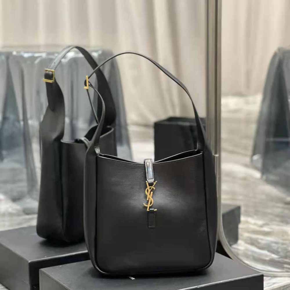 Close-up of silver YSL logo hardware on black smooth leather bag