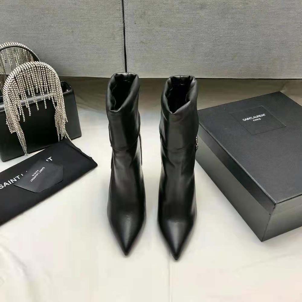 Close-up of silver YSL monogram on Saint Laurent YSL Women Niki Booties