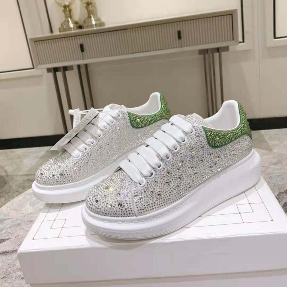 Close-up of acid green heel tab on Alexander Mcqueen Women Oversized Sneaker