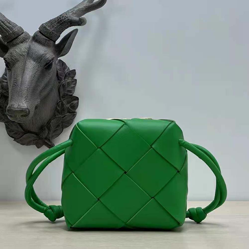 Close-up of intrecciato leather detail on Bottega Veneta Women Mini Cassette Camera Bag-Green