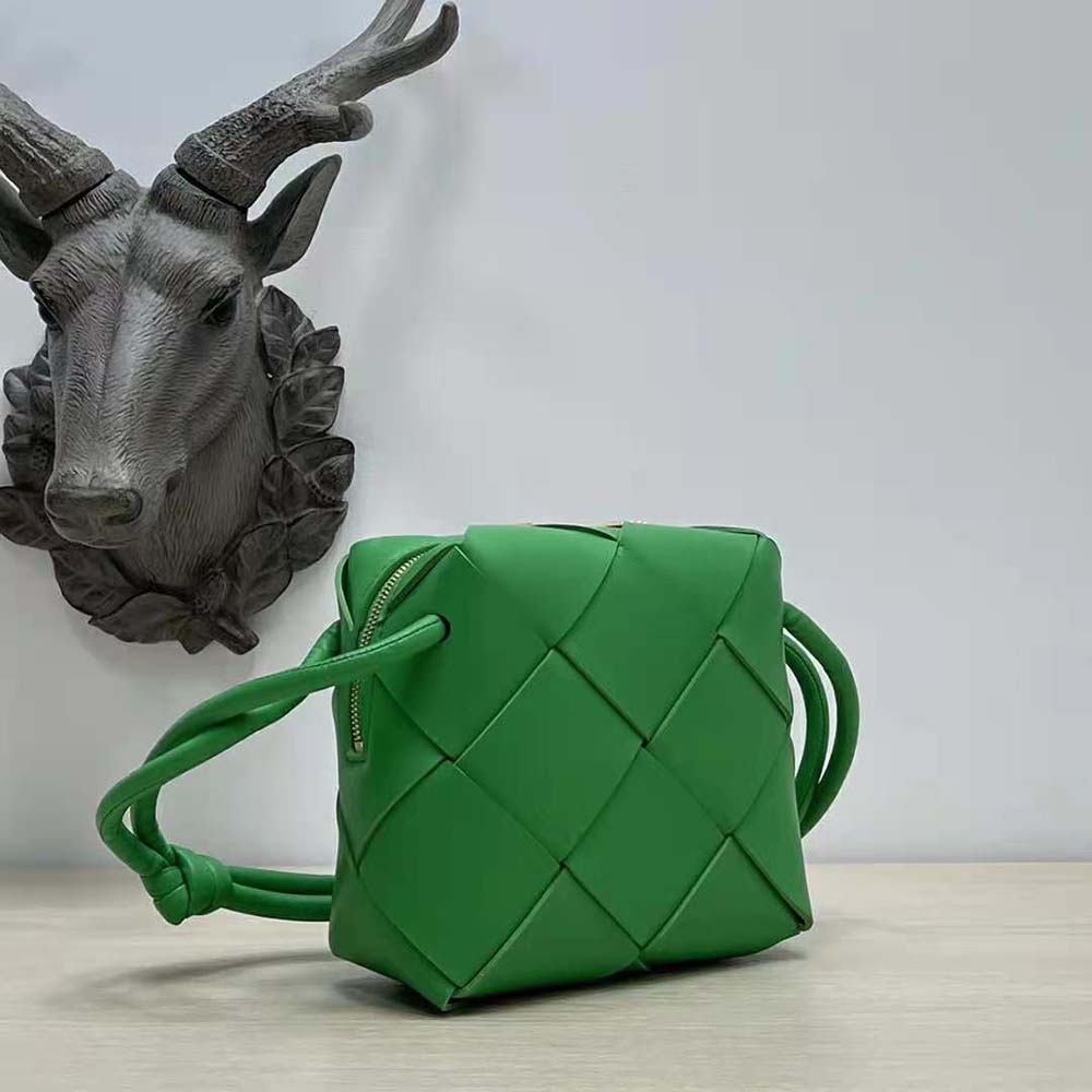 Side profile of Bottega Veneta Women Mini Cassette Camera Bag-Green with gold hardware