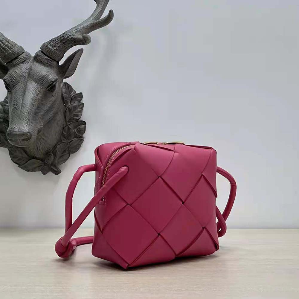Side angle showing adjustable shoulder strap of Bottega Veneta Women Mini Cassette Camera Bag-Rose