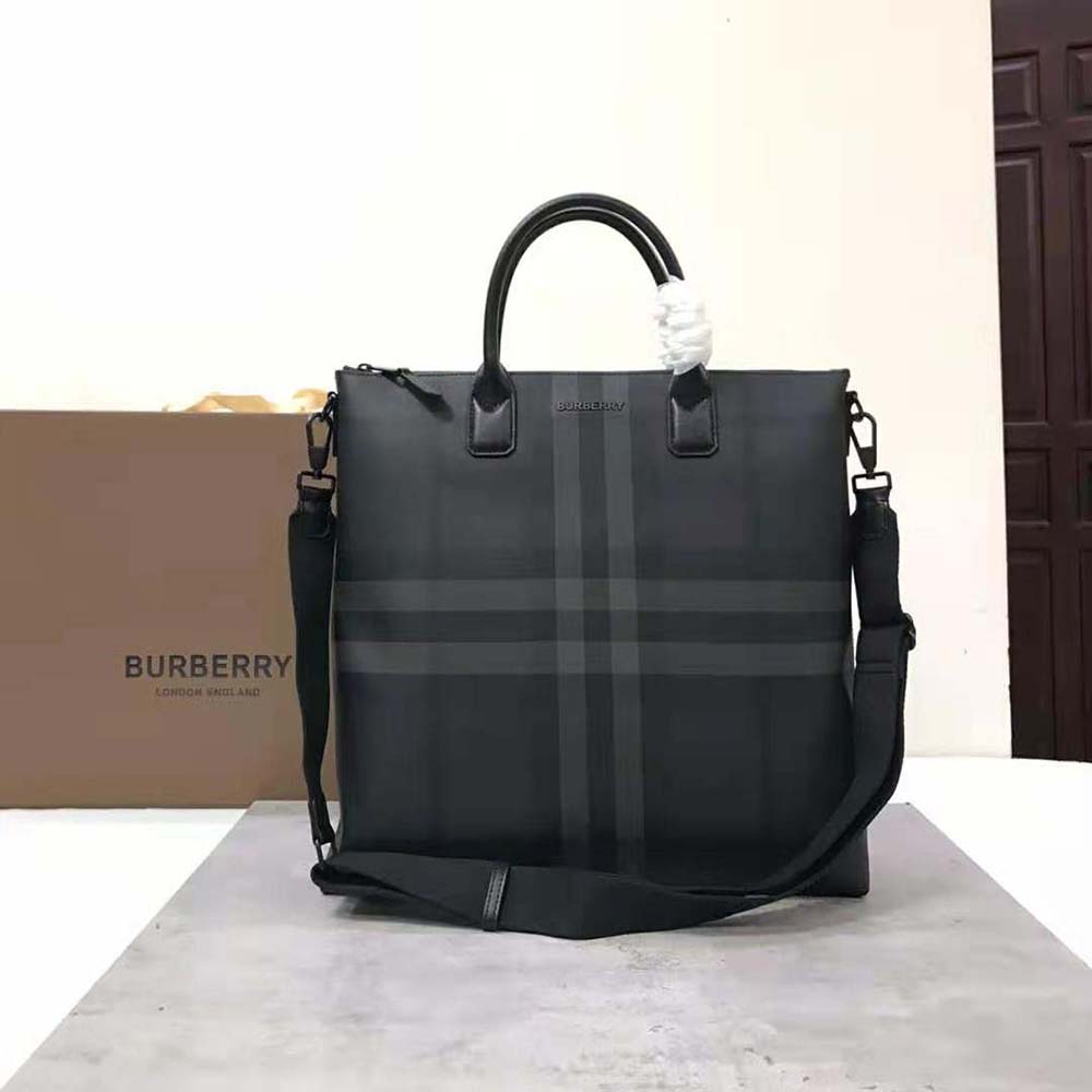 Close-up of black leather and gunmetal hardware on Burberry Men Charcoal Tote