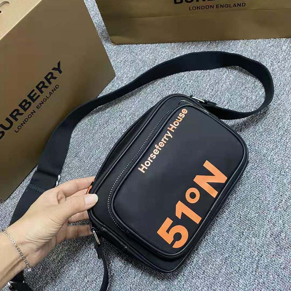 Close-up of orange nylon and signature coordinates print on Burberry crossbody bag