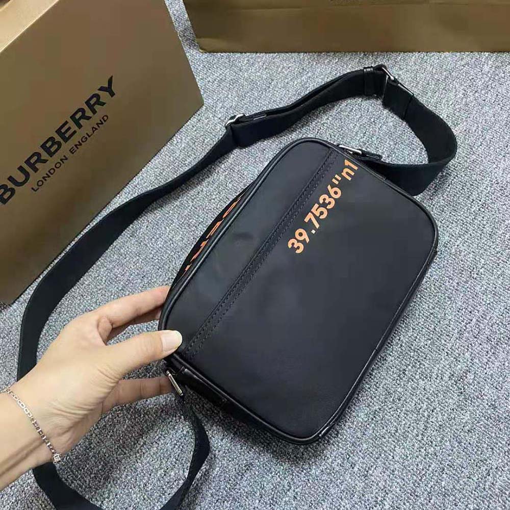 Side angle highlighting adjustable strap and branded hardware on Burberry crossbody bag