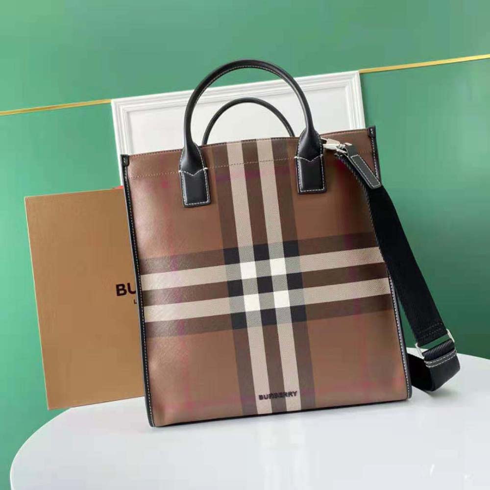 Close-up on Burberry check and leather detail of slim tote brown