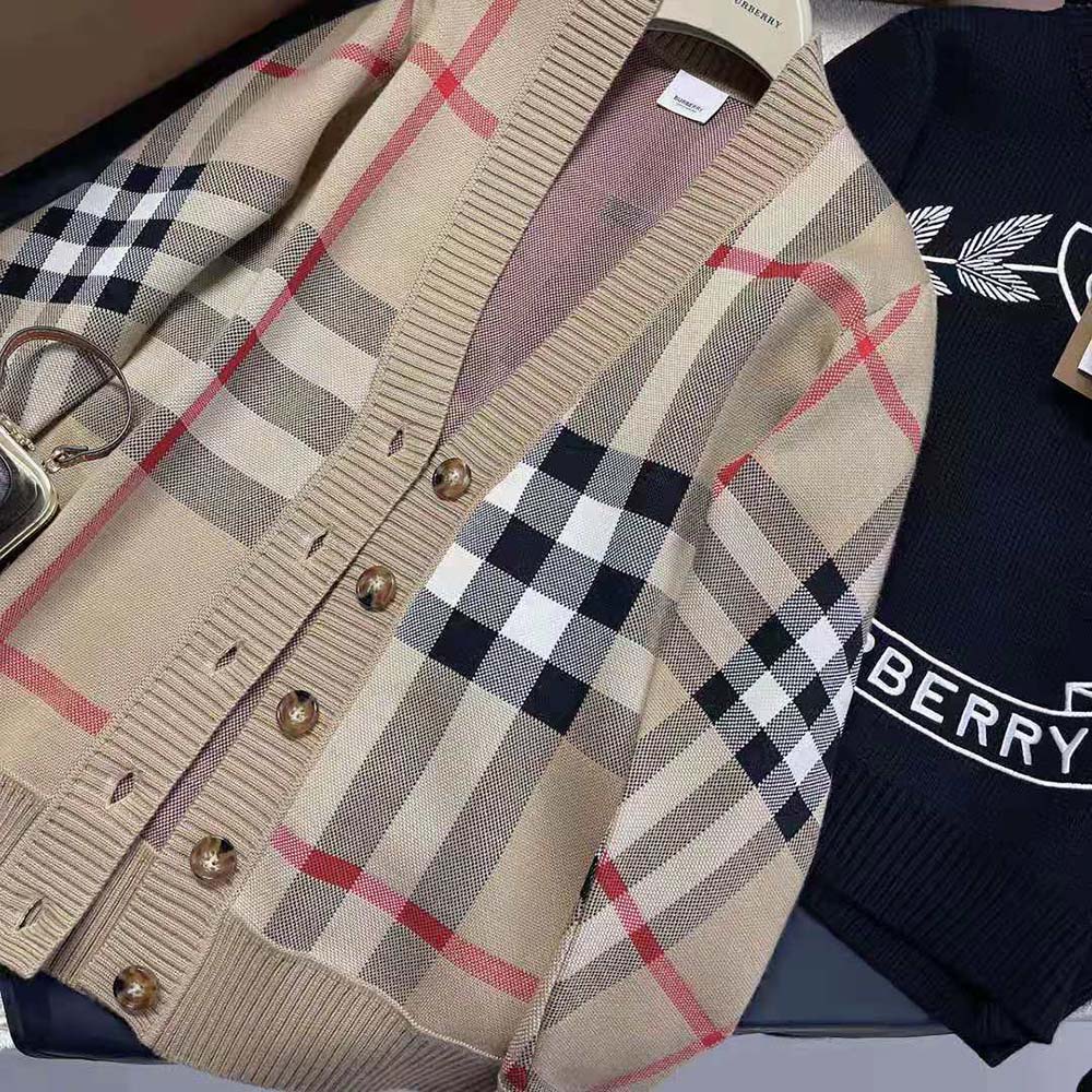Side angle showing button closure on Burberry wool jacquard cardigan