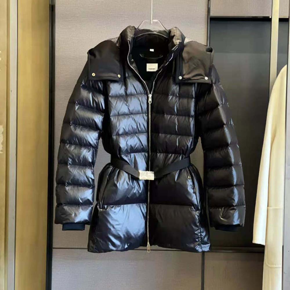 Close-up of the belted waist and signature hardware on Burberry puffer jacket