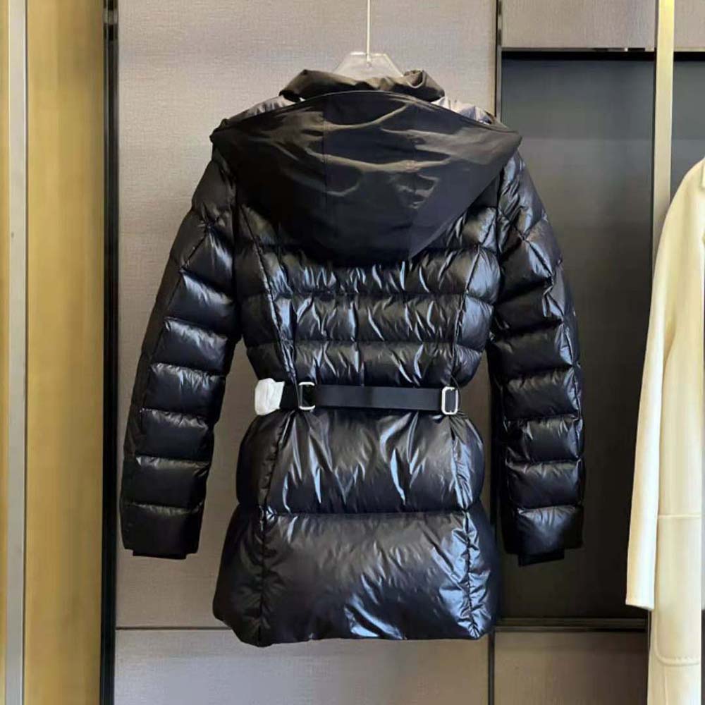 Side profile highlighting contrast hood and silhouette of Burberry puffer jacket